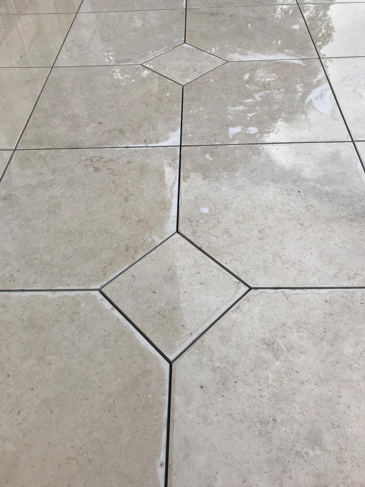 Natural limestone floor with diamond inset detail