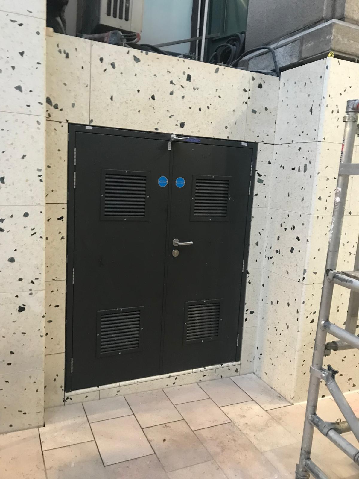 Stone cladding panels around a building entrance